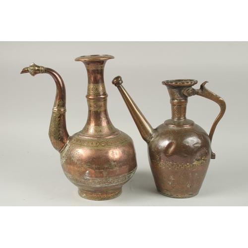 168 - A PERSIAN SAFAVID ENGRAVED COPPER EWER, together with another engraved tinned copper ewer, 33cm and ... 