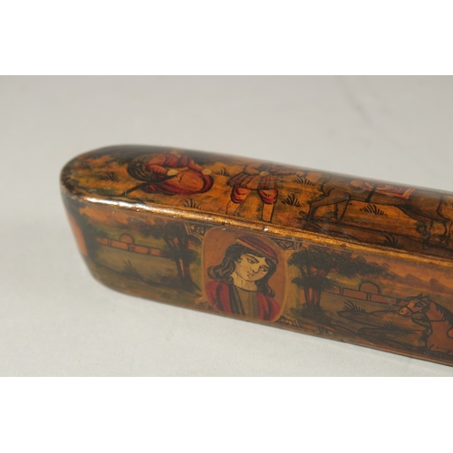 169 - A PERSIAN QAJAR LACQUER PAPIER MACHE PEN BOX, painted with figures and portraits, 22.5cm long.