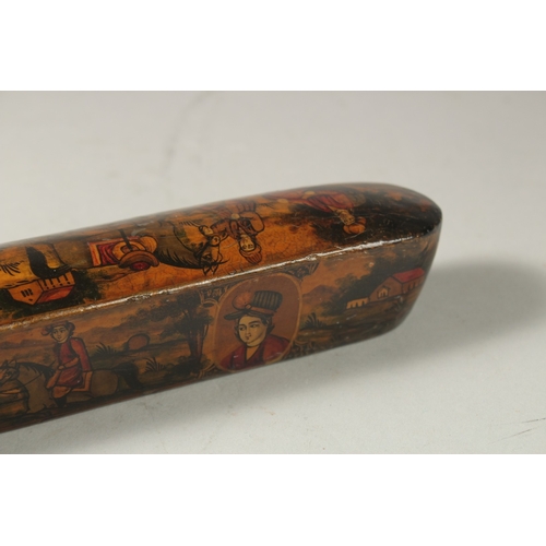 169 - A PERSIAN QAJAR LACQUER PAPIER MACHE PEN BOX, painted with figures and portraits, 22.5cm long.