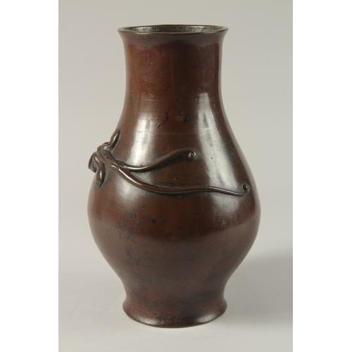 185 - A 19TH CENTURY CHINESE BRONZE VASE, with raised chilong decoration, 28cm high.