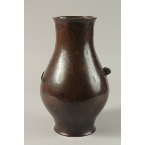 185 - A 19TH CENTURY CHINESE BRONZE VASE, with raised chilong decoration, 28cm high.