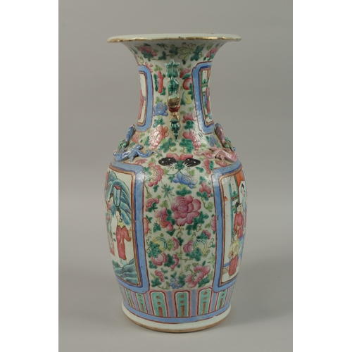 20 - A CHINESE FAMILLE ROSE PORCELAIN TWIN HANDLE VASE, with panels of figures, (af), 43cm high.