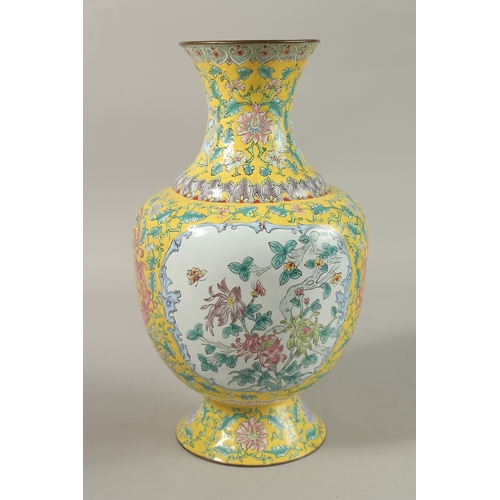 207 - A CHINESE YELLOW GROUND ENAMELLED VASE, painted with a panel depicting an exotic bird and flora, fur... 