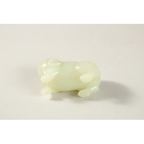 210 - A CHINESE JADE CARVING OF A PIG, 5cm long.