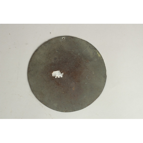 214 - AN ENGRAVED AND CHASED METAL CIRCULAR PLAQUE, depicting cranes beside a tree, 13.5cm diameter.