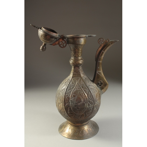 218 - A FINE INDIAN BRASS EWER, with embossed and chased fish decoration, 40cm high.