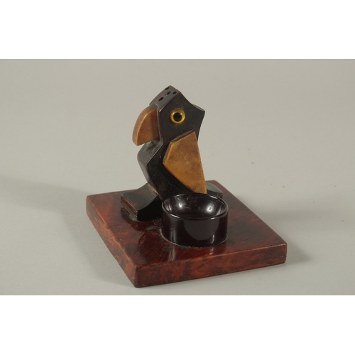 219 - AN EARLY 20TH CENTURY ART DECO DUNHILL STYLE BIRD-SHAPED MATCH HOLDER, with bakelite or cherry amber... 