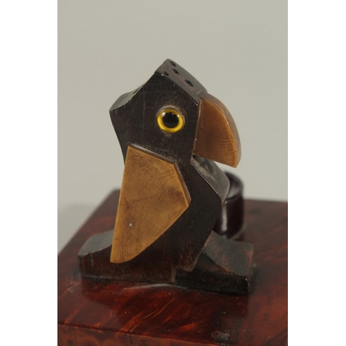 219 - AN EARLY 20TH CENTURY ART DECO DUNHILL STYLE BIRD-SHAPED MATCH HOLDER, with bakelite or cherry amber... 