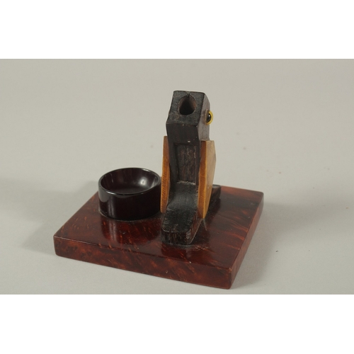 219 - AN EARLY 20TH CENTURY ART DECO DUNHILL STYLE BIRD-SHAPED MATCH HOLDER, with bakelite or cherry amber... 