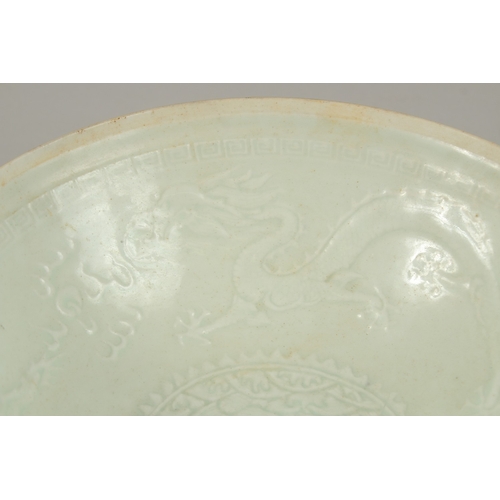 22 - A CHINESE CELADON GLAZE EGGSHELL PORCELAIN DRAGON BOWL, 19.5cm diameter.