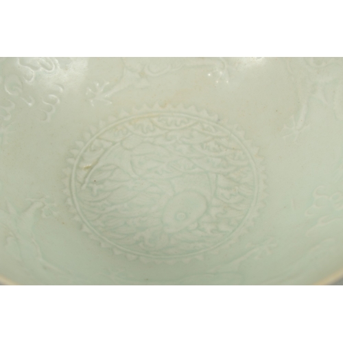 22 - A CHINESE CELADON GLAZE EGGSHELL PORCELAIN DRAGON BOWL, 19.5cm diameter.