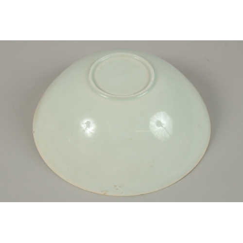 22 - A CHINESE CELADON GLAZE EGGSHELL PORCELAIN DRAGON BOWL, 19.5cm diameter.