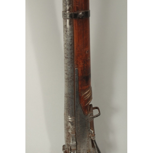 222 - A FINE 18-19TH CENTURY MUGHAL INDIAN MATCHLOCK RIFLE. 155cm long.