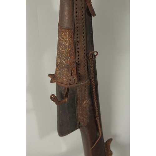 223 - AN 18TH CENTURY MUGHAL INDIAN MATCHLOCK RIFLE, with gold inlaid barrel and trigger.