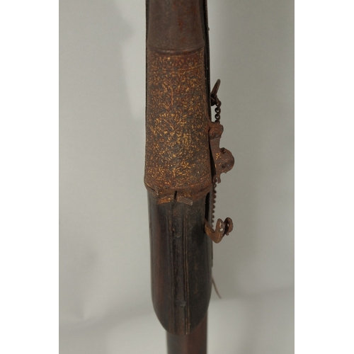 223 - AN 18TH CENTURY MUGHAL INDIAN MATCHLOCK RIFLE, with gold inlaid barrel and trigger.