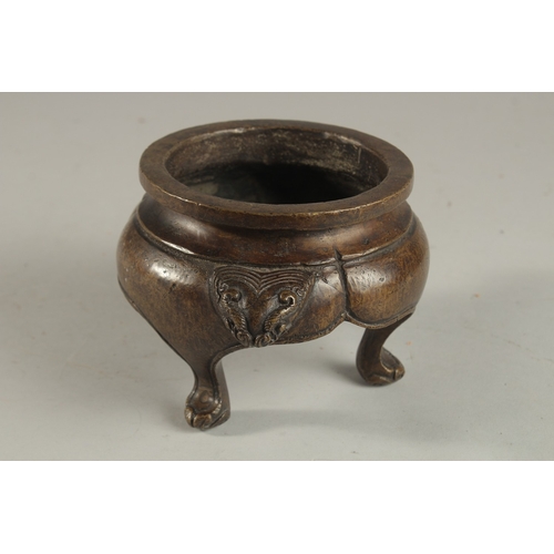 234 - A CHINESE BRONZE TRIPOD CENSER, with lion face handles, the base with character mark, 17cm wide (han... 