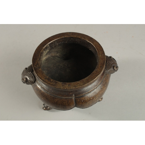 234 - A CHINESE BRONZE TRIPOD CENSER, with lion face handles, the base with character mark, 17cm wide (han... 