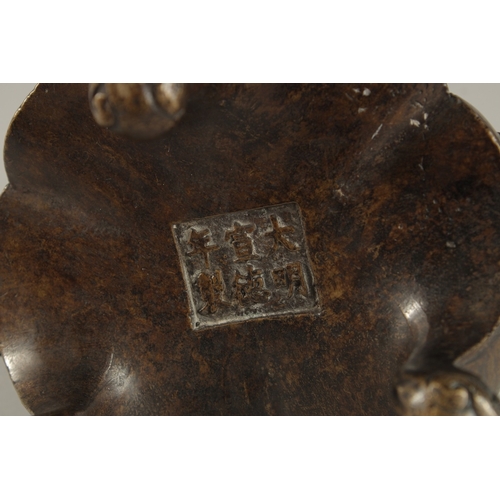 234 - A CHINESE BRONZE TRIPOD CENSER, with lion face handles, the base with character mark, 17cm wide (han... 