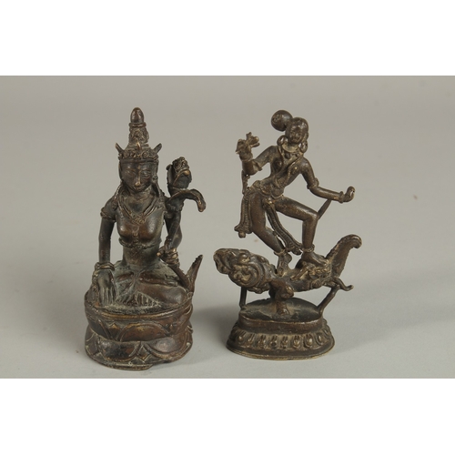 235 - A FINE 19TH CENTURY TIBETAN BRONZE FIGURE OF A FEMALE DEITY, together with an early South East Asian... 