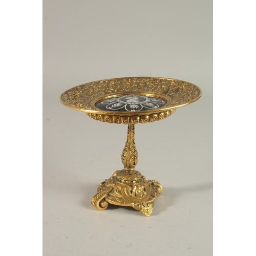 239 - A RARE 19TH CENTURY FRENCH GILT BRONZE TAZZA, with a central enamel plaque with a portrait of an Ott... 