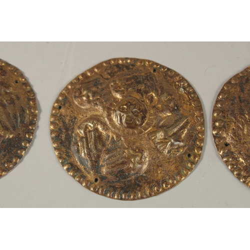 241 - A COLLECTION OF THREE 18TH-19TH CENTURY OTTOMAN ARMENIAN GILT COPPER CIRCULAR PLAQUES, depicting ang... 