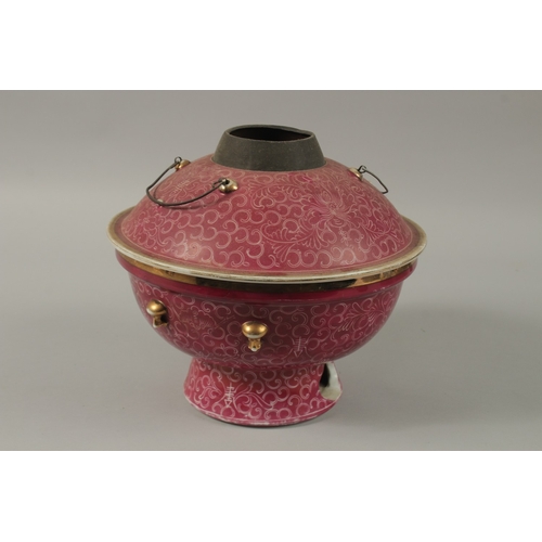 25 - A CHINESE PINK GLAZE PORCELAIN CIRCULAR WARMER AND COVER, 26cm diameter.