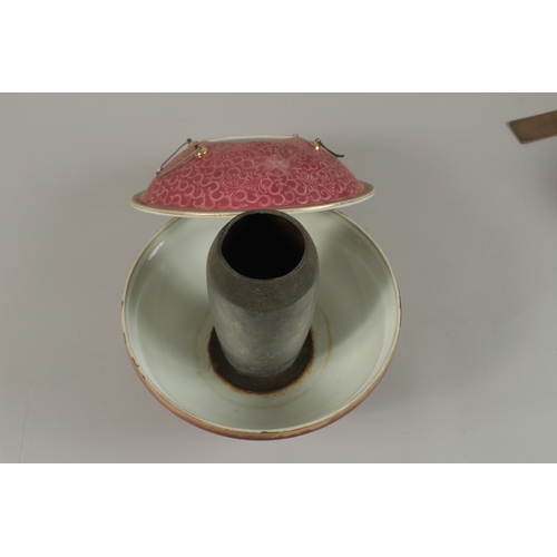 25 - A CHINESE PINK GLAZE PORCELAIN CIRCULAR WARMER AND COVER, 26cm diameter.