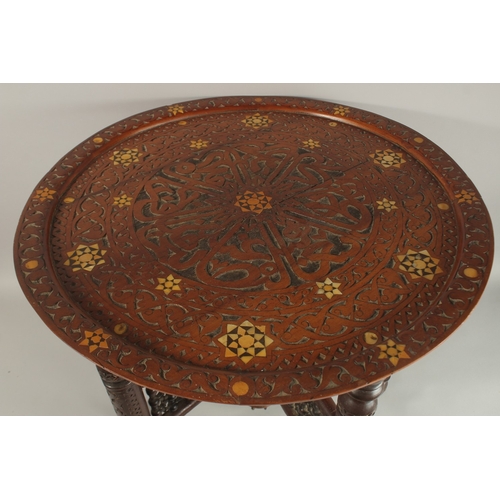 259 - A FINE 19TH CENTURY SYRIAN DAMASCUS MOTHER OF PEARL INLAID WOODEN TABLE, with folding legs.