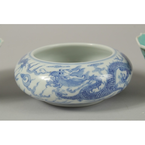 26 - A CHINESE BLUE AND WHITE PORCELAIN DRAGON BOWL, together with a pair of turquoise ground petal rim b... 