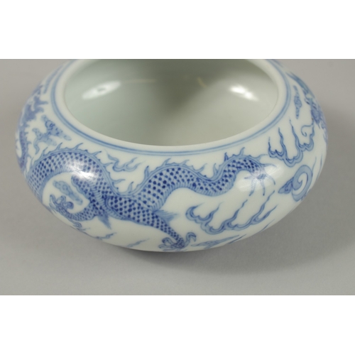 26 - A CHINESE BLUE AND WHITE PORCELAIN DRAGON BOWL, together with a pair of turquoise ground petal rim b... 