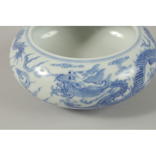 26 - A CHINESE BLUE AND WHITE PORCELAIN DRAGON BOWL, together with a pair of turquoise ground petal rim b... 