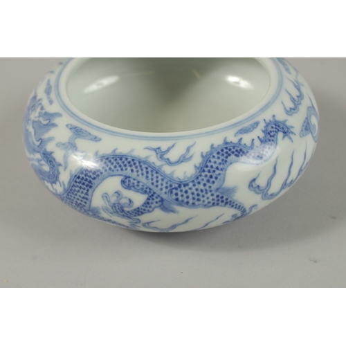 26 - A CHINESE BLUE AND WHITE PORCELAIN DRAGON BOWL, together with a pair of turquoise ground petal rim b... 