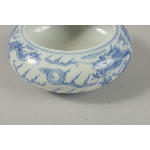 26 - A CHINESE BLUE AND WHITE PORCELAIN DRAGON BOWL, together with a pair of turquoise ground petal rim b... 