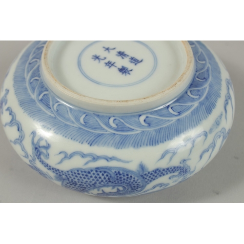 26 - A CHINESE BLUE AND WHITE PORCELAIN DRAGON BOWL, together with a pair of turquoise ground petal rim b... 