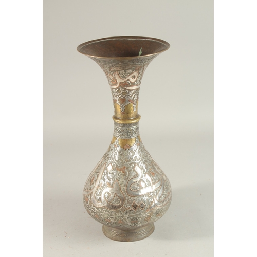 265 - A FINE 19TH CENTURY SYRIAN SILVER AND COPPER INLAID BRASS VASE, with large bands of calligraphy, 36c... 