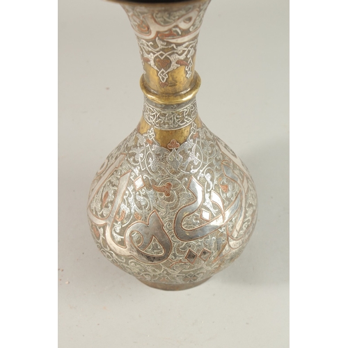 265 - A FINE 19TH CENTURY SYRIAN SILVER AND COPPER INLAID BRASS VASE, with large bands of calligraphy, 36c... 