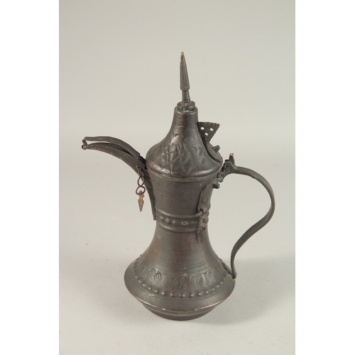 268 - A 20TH CENTURY OMANI COFFEE POT, 33cm high.