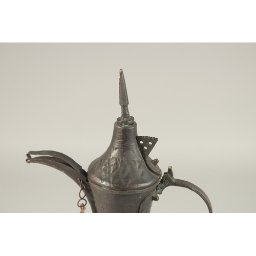 268 - A 20TH CENTURY OMANI COFFEE POT, 33cm high.