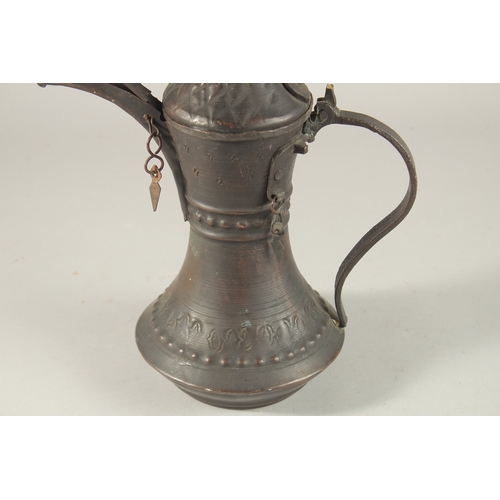 268 - A 20TH CENTURY OMANI COFFEE POT, 33cm high.