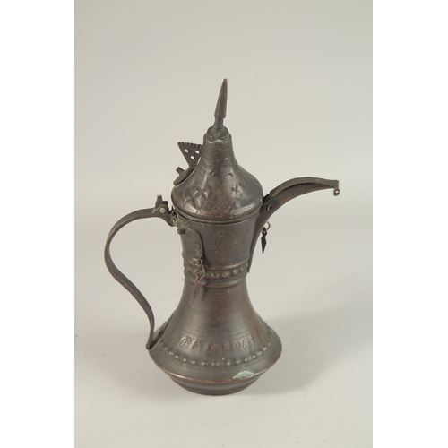 268 - A 20TH CENTURY OMANI COFFEE POT, 33cm high.