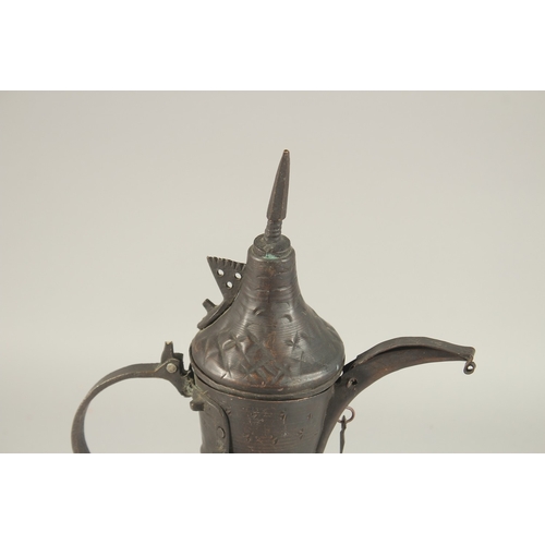 268 - A 20TH CENTURY OMANI COFFEE POT, 33cm high.