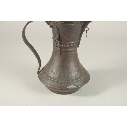 268 - A 20TH CENTURY OMANI COFFEE POT, 33cm high.