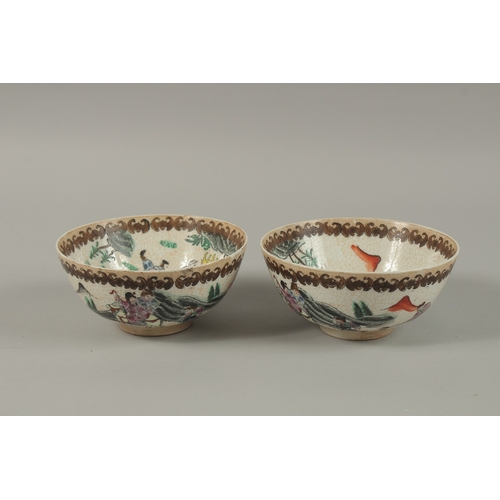 27 - A PAIR OF CHINESE PORCELAIN BOWLS, painted with figures on horseback, 15cm diameter.