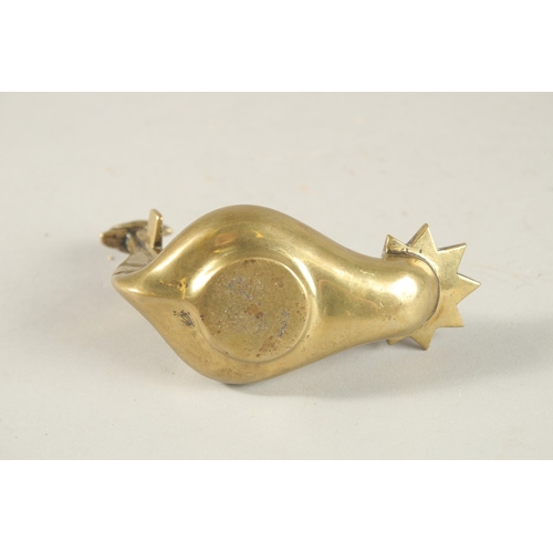 270 - A BRASS OIL LAMP WITH CROSS AND BIRD HANDLE, 10.5cm long.