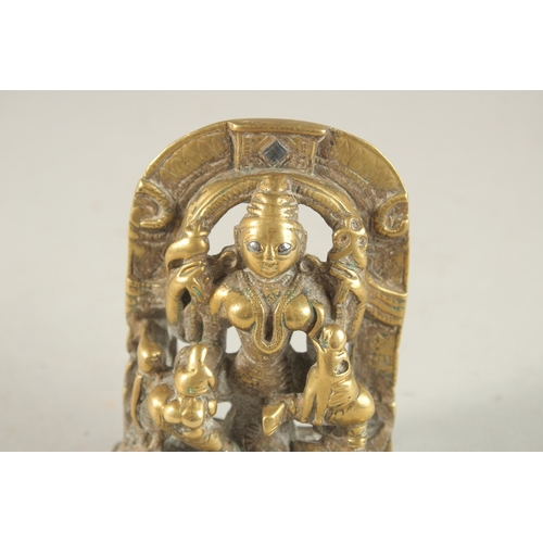 273 - A 19TH CENTURY INDIAN SILVER INLAID GILT BRONZE DEITY, the silver inlays to the eyes and upper arch,... 