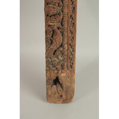 276 - A 16TH-17TH CENTURY INDIAN CARVED WOOD PANEL, with peacock and parrot designs, 136cm long.