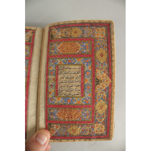 277 - A FINE 19TH CENTURY QAJAR POCKET SIZE QURAN, with original lacquered floral cover and finely gilded ... 