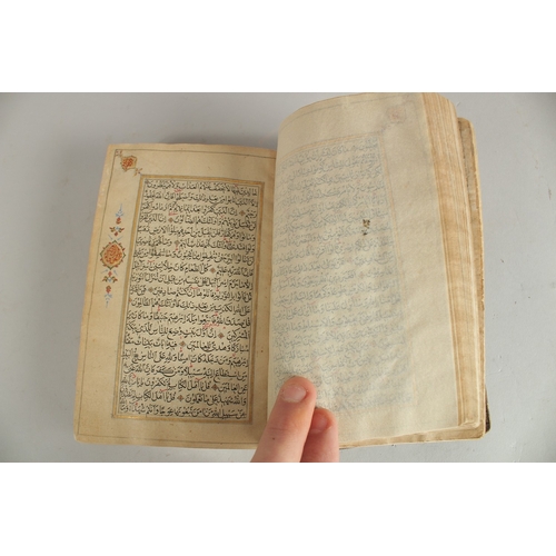 277 - A FINE 19TH CENTURY QAJAR POCKET SIZE QURAN, with original lacquered floral cover and finely gilded ... 