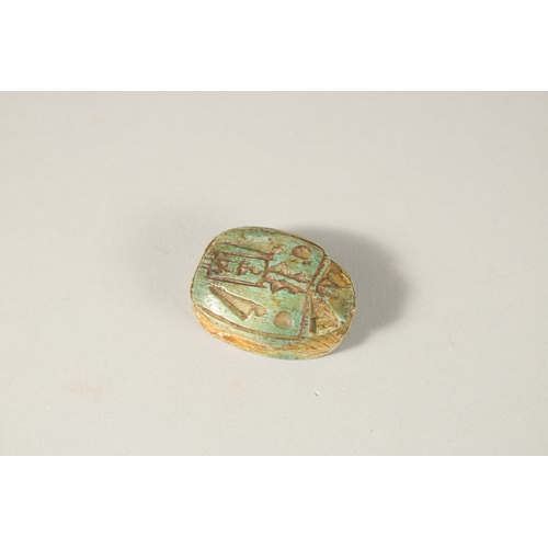 285 - AN EGYPTIAN CARVED SCARAB BEAD, 3.5cm long.