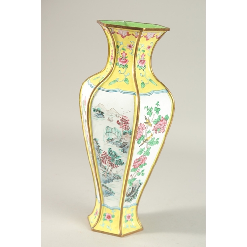 286 - A CHINESE CANTON YELLOW GROUND ENAMELLED HEXAGONAL VASE, 33cm high.